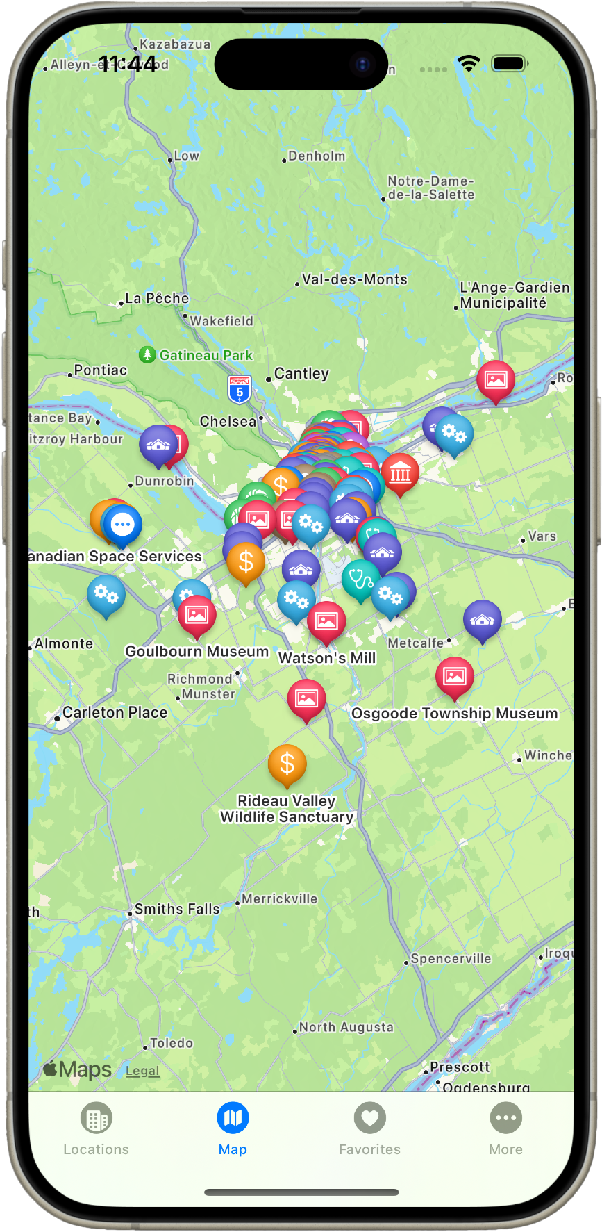 Screenshot of a map on a phone showing a section of southeastern Ontario, Canada. The map is centered on the Ottawa River near the town of Ottawa. Place names are visible in both English and French. Some of the labeled locations include Gatineau Park, Pontiac, Chelsea, and Carleton Place. A menu with icons for Maps, Locations, Favourites, and More is visible along the bottom right of the screen.